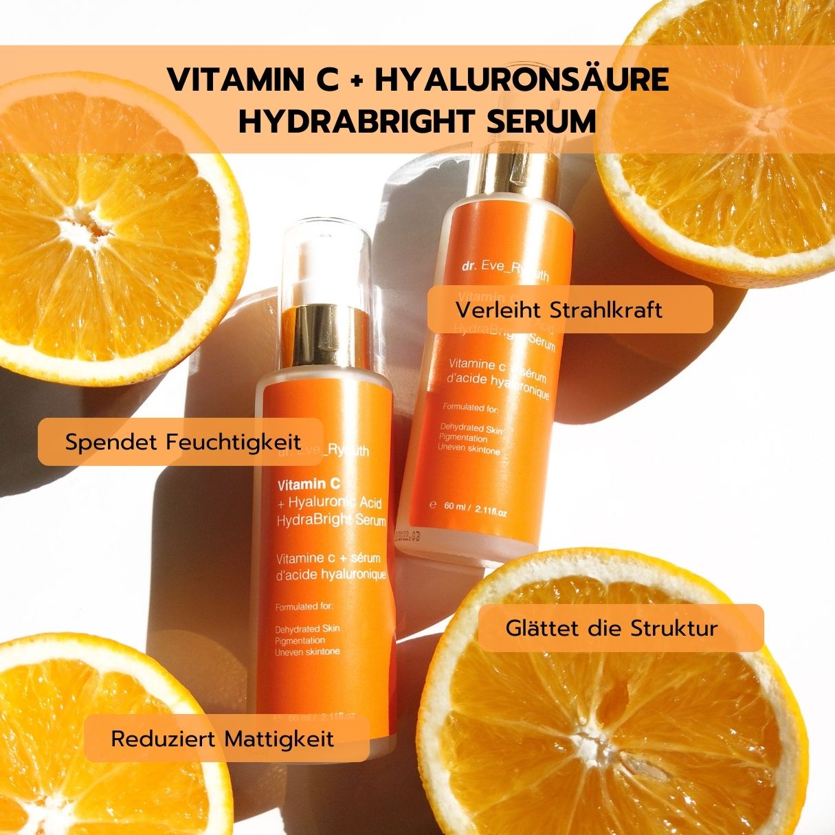 Deux flacons de sérum Dr. Eve Ryouth Vitamine C + Acide Hyaluronique Hydrabright entourés de tranches d'orange.