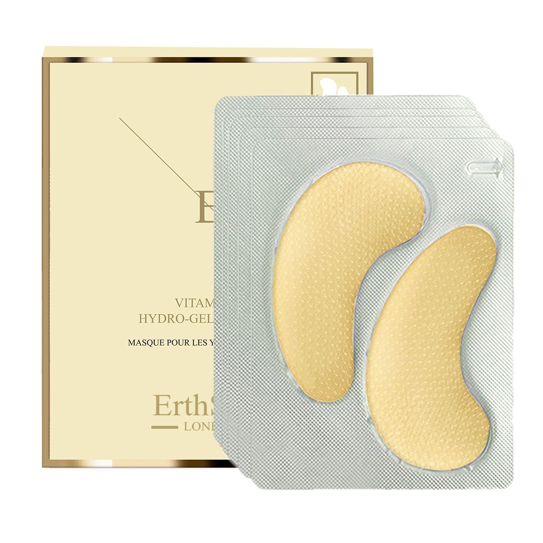 Twee gele oogpads in een geopende blisterverpakking. Daarnaast een productverpakking met logo en tekst.