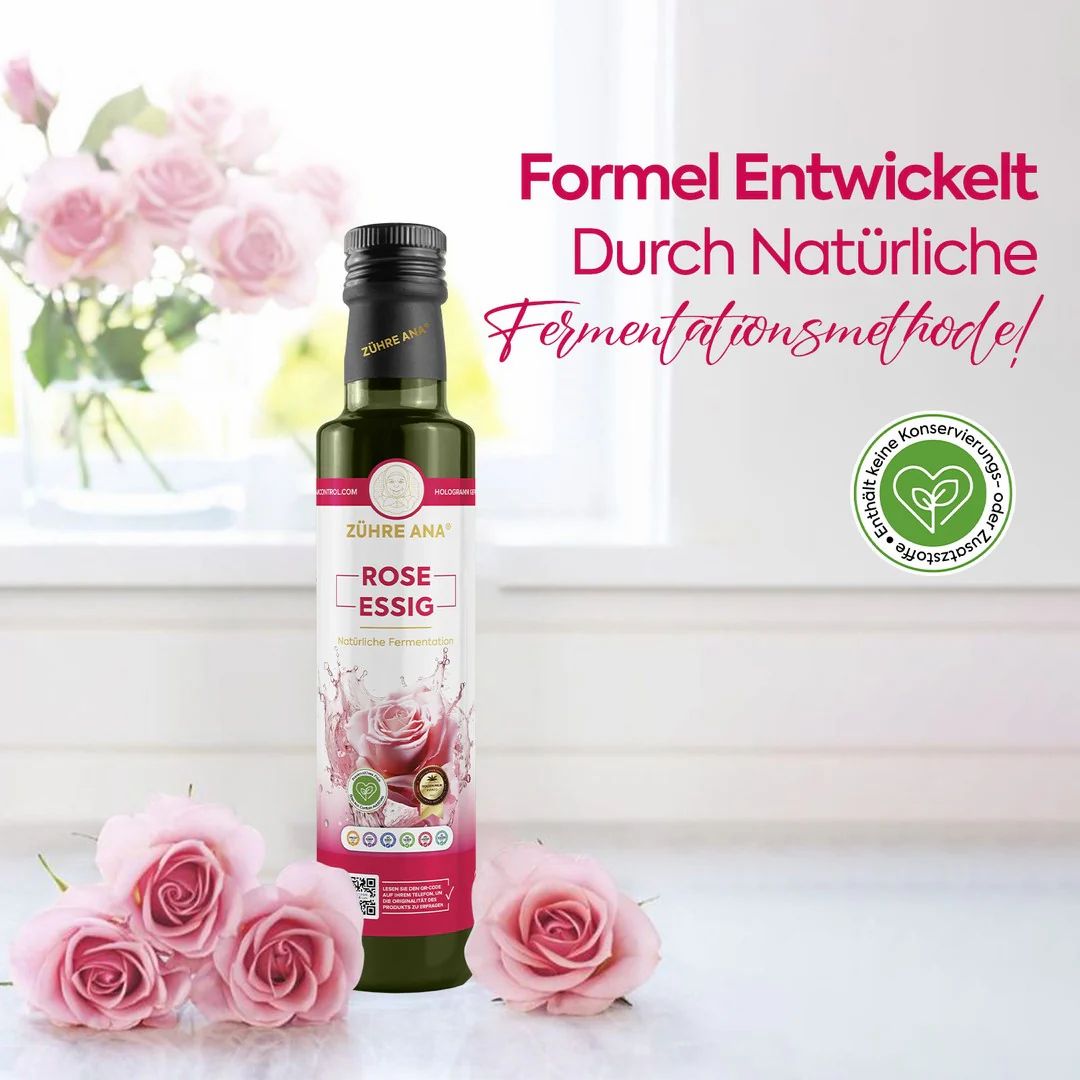 Bouteille de vinaigre de rose à côté de pétales de rose, avec le texte 'Formel Entwickelt Durch Natürliche Fermentationsmethode'.