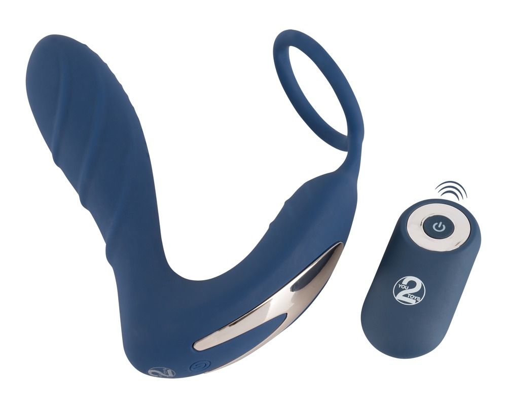 Plug anal bleu avec anneau pénien et stimulateur périnéal, avec télécommande. Logo You2Toys visible sur la télécommande.