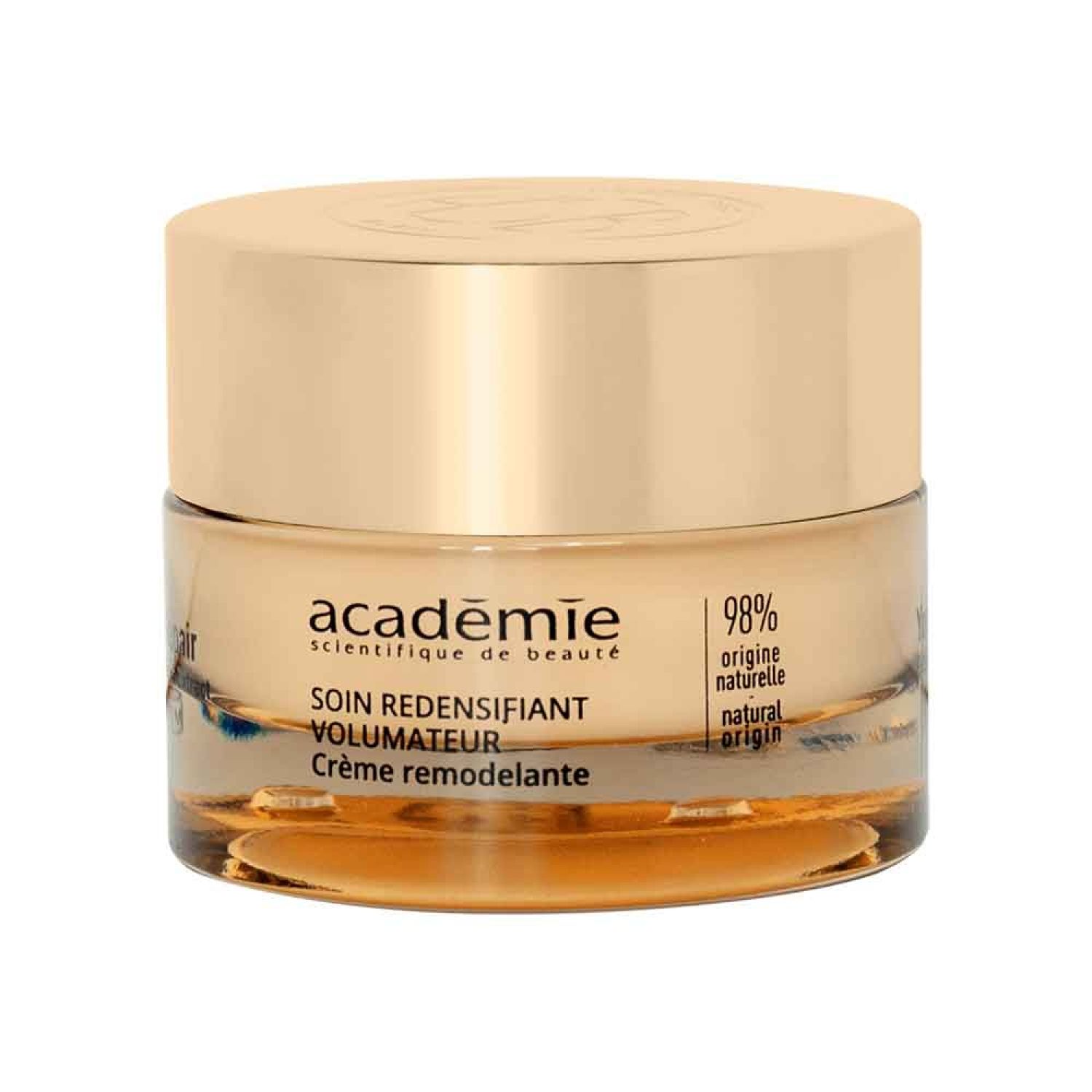 Crèmepot met gouden deksel. Op de pot staat "académie scientifique de beauté". Tekst: SOIN REDENSIFIANT VOLUMATEUR. 98% natuurlijke oorsprong.