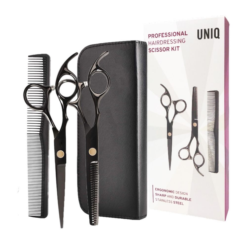 Kappersset met twee scharen, kam en zwarte etui, verpakt in doos.