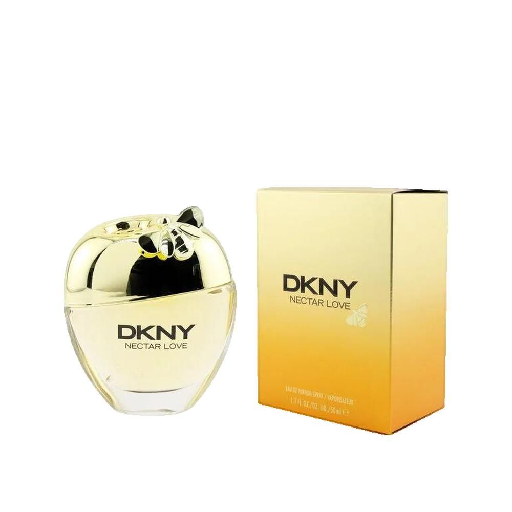 Parfumfles en verpakking. Appel-vormige fles met gouden dop. Gouden en oranje verpakking met DKNY Nectar Love tekst.