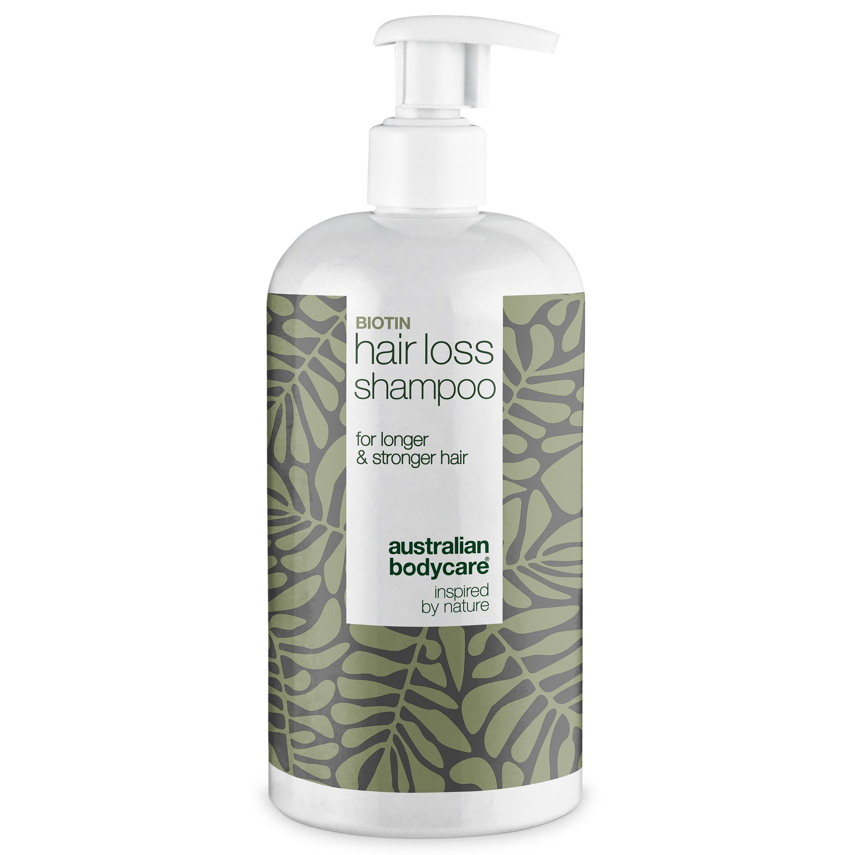 Flacon de shampooing avec pompe. Inscription : Hair Loss Shampoo. Design vert et blanc avec des feuilles.