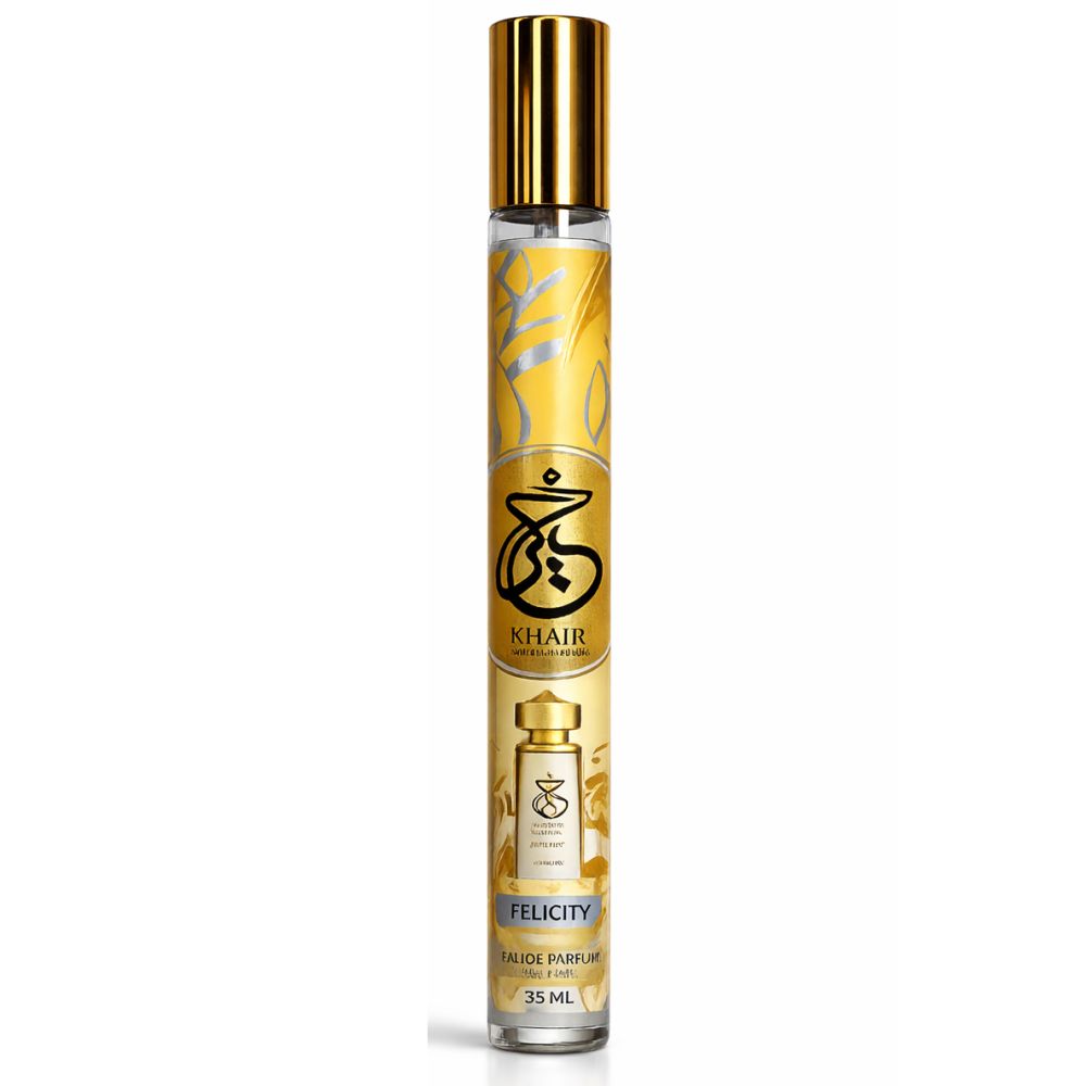 Flacon de parfum cylindrique avec bouchon doré. Étiquette jaune avec inscription 'Khair Felicity'.