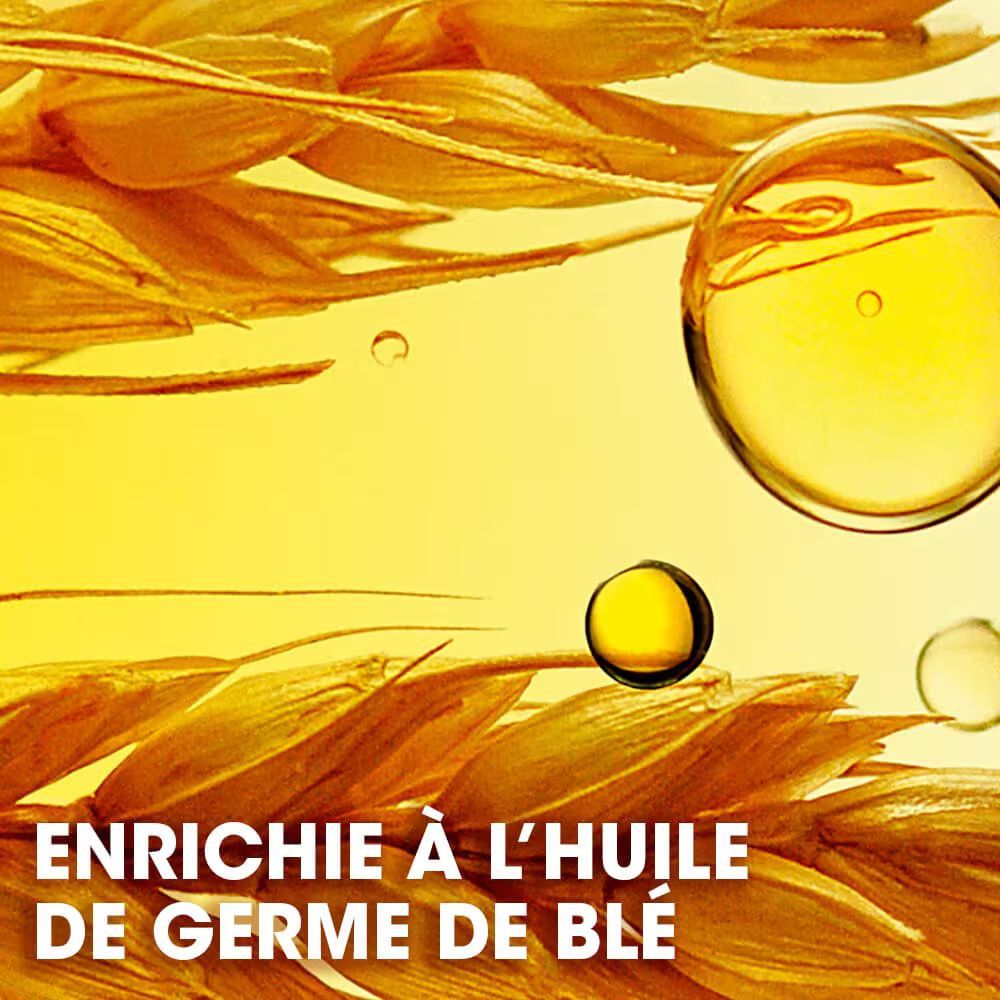 Gouden oliedruppels en tarwearen. Tekst: ENRICHIE À L'HUILE DE GERME DE BLÉ.