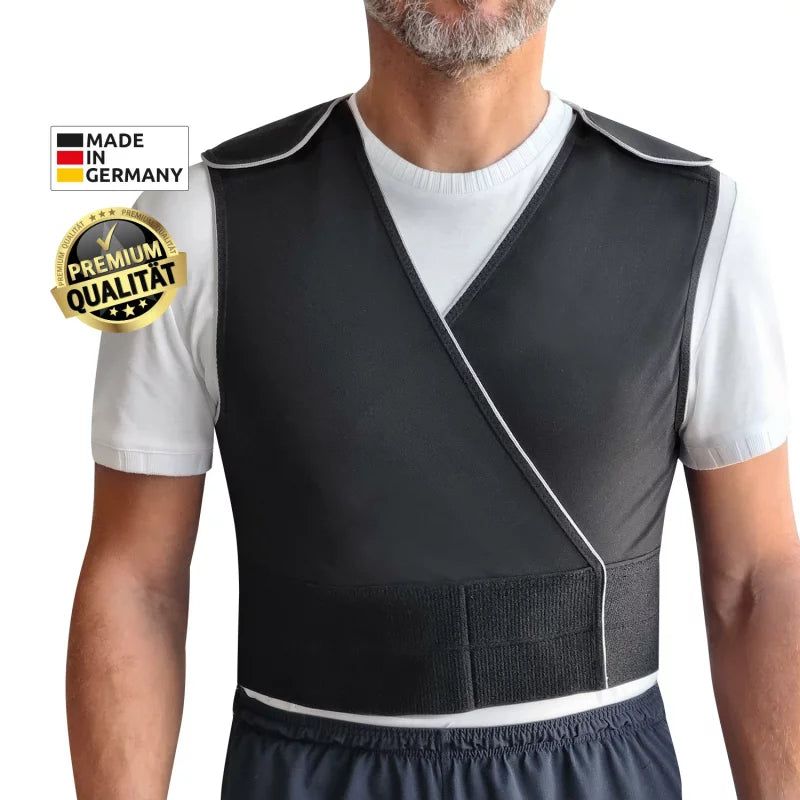 Gilet noir avec bordure blanche, porté par une personne. Logos "Made in Germany" et "Premium Qualität" visibles sur le gilet.