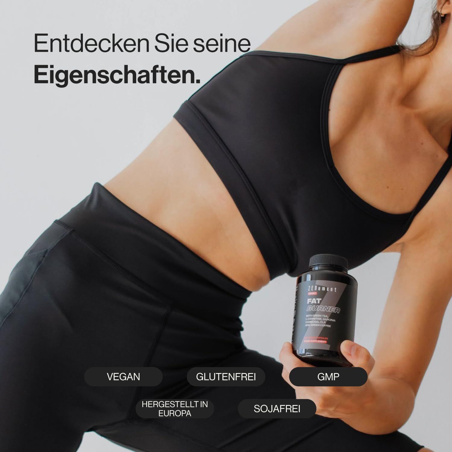 Zwarte fles Zenement Fettverbrenner. Vegan, glutenvrij, GMP-gecertificeerd. Vrouw in sportkleding houdt de fles vast.