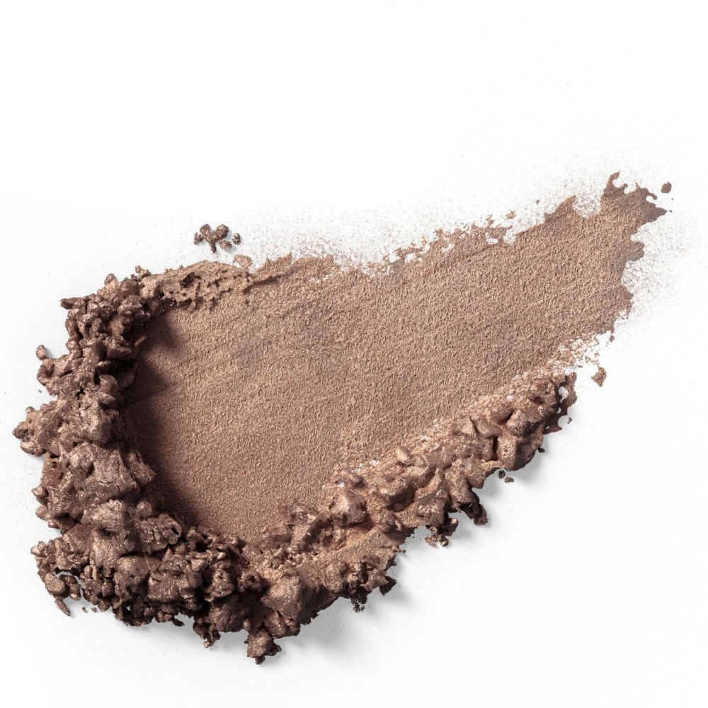 Lichte, bruine oogschaduwveeg op witte achtergrond. Textuur met zichtbare deeltjes.