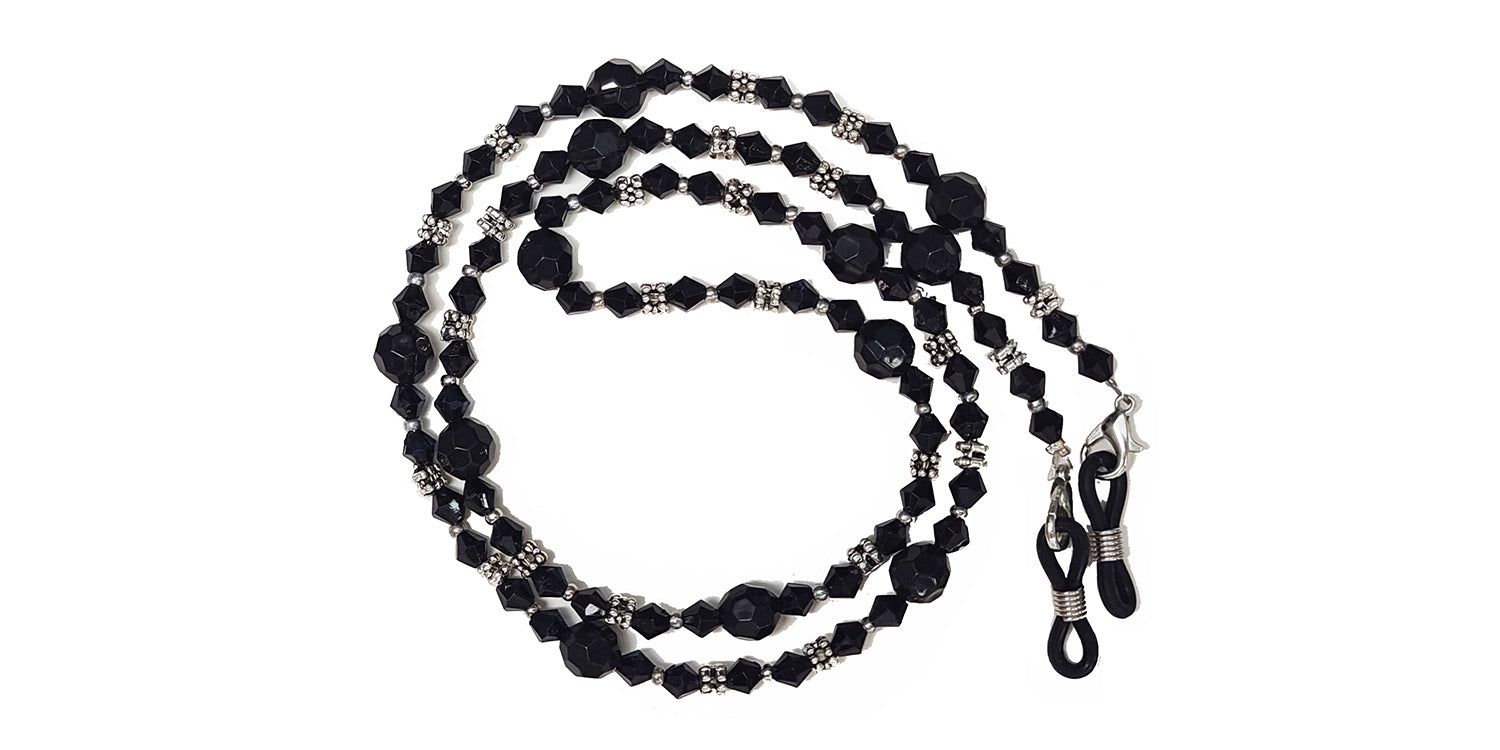 Cordon à lunettes noir avec perles et cristaux. Attaches métalliques. Boucles pour fixer les lunettes.
