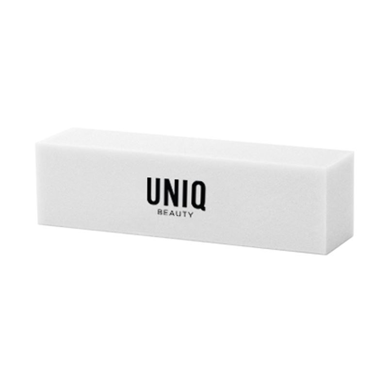 Bloc polissoir blanc avec logo noir "UNIQ BEAUTY". Forme rectangulaire.