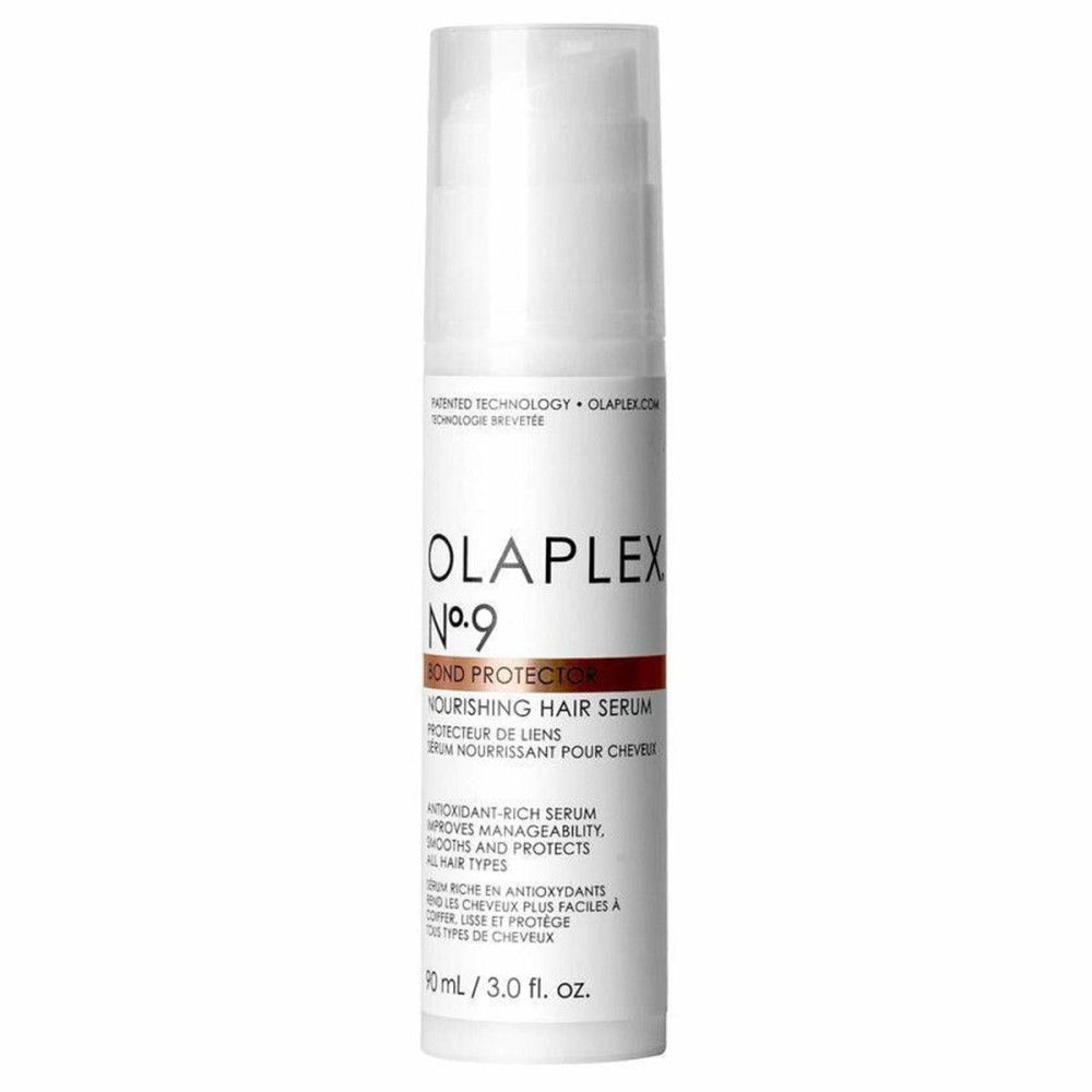 Sérum capillaire protecteur Olaplex No.9. Flacon blanc avec pompe. Nom du produit et texte sur le devant.