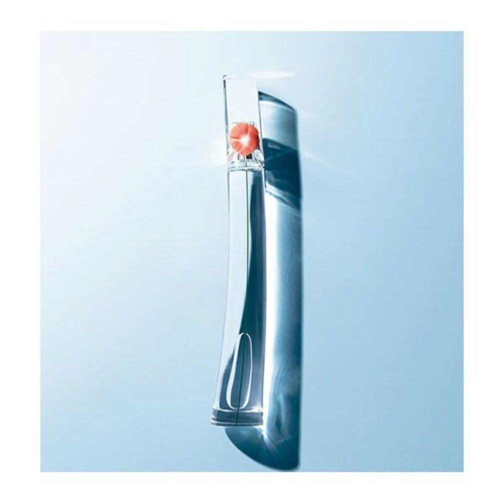 Flacon transparent avec fleur rouge, sur fond bleu. Ombre portée.