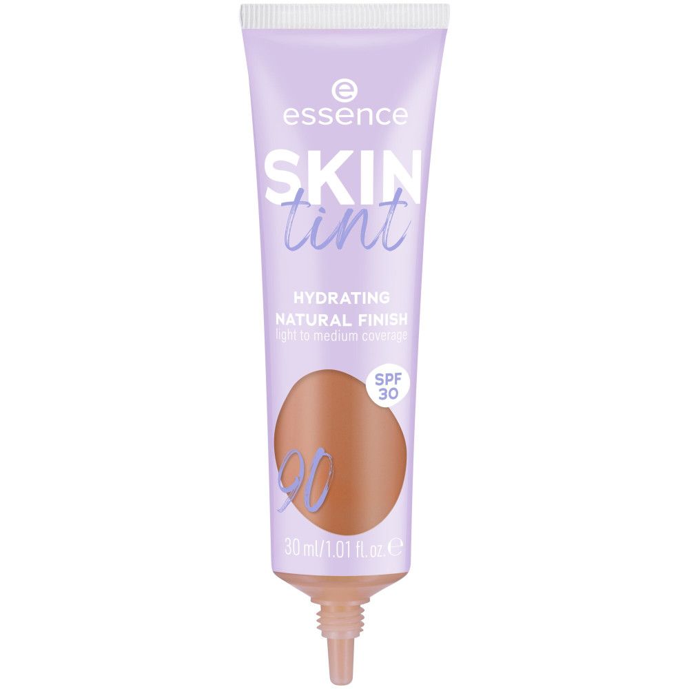 Tube de fond de teint Skin Tint. Tube lilas avec bouchon blanc. Inscription : Skin Tint, SPF 30. Teinte 90.
