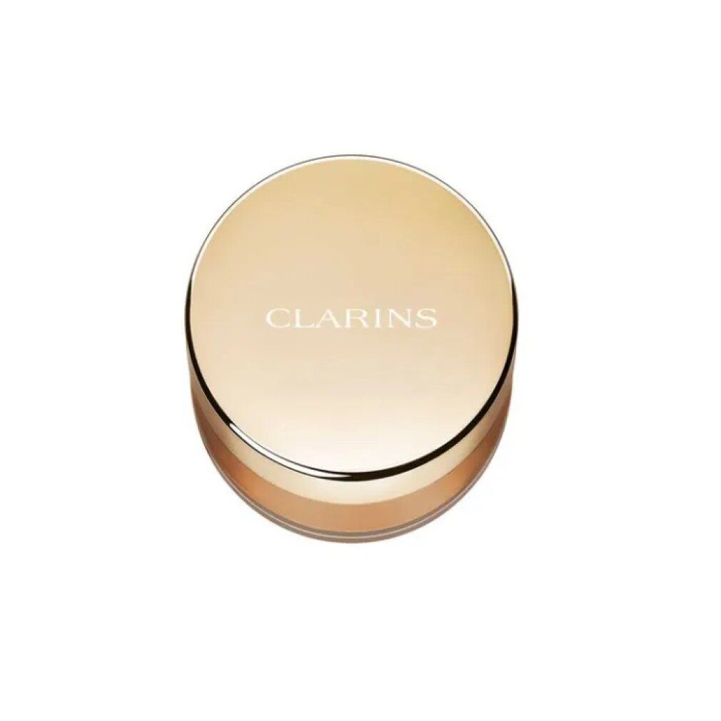 Gouden ronde verpakking met CLARINS-logo. Zichtbaar poeder in lichtbruine tint.