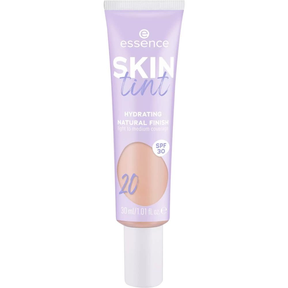 Fond de teint teinté dans un tube violet. Contient SPF 30. Inscription : SKIN tint, 20. 30 ml/1.01 fl. oz.