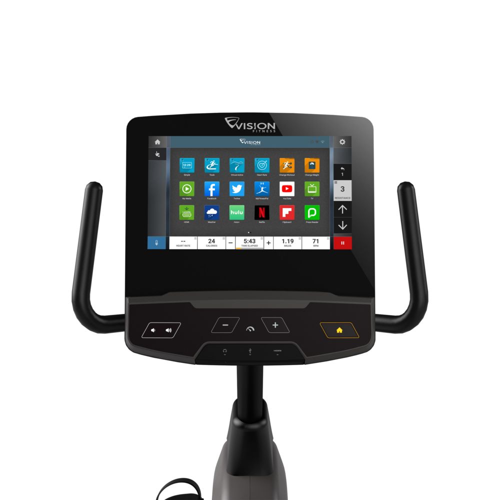 Close-up van het digitale display van een hometrainer. VISION-logo. Touchscreen met app-iconen. Zwart frame.