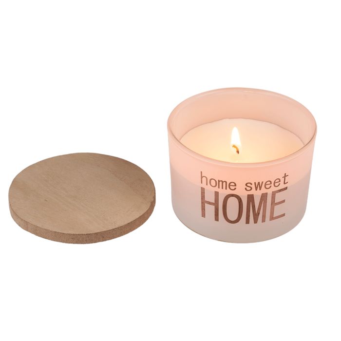 Geurkaars met houten deksel. Opschrift "home sweet HOME". Kaars brandt. Deksel ernaast.