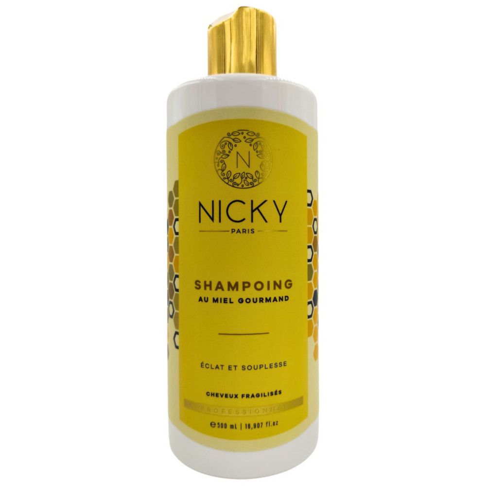 Gele shampoo fles met gouden dop. Opschrift: Nicky Paris, SHAMPOING AU MIEL GOURMAND, Eclat et Souplesse.