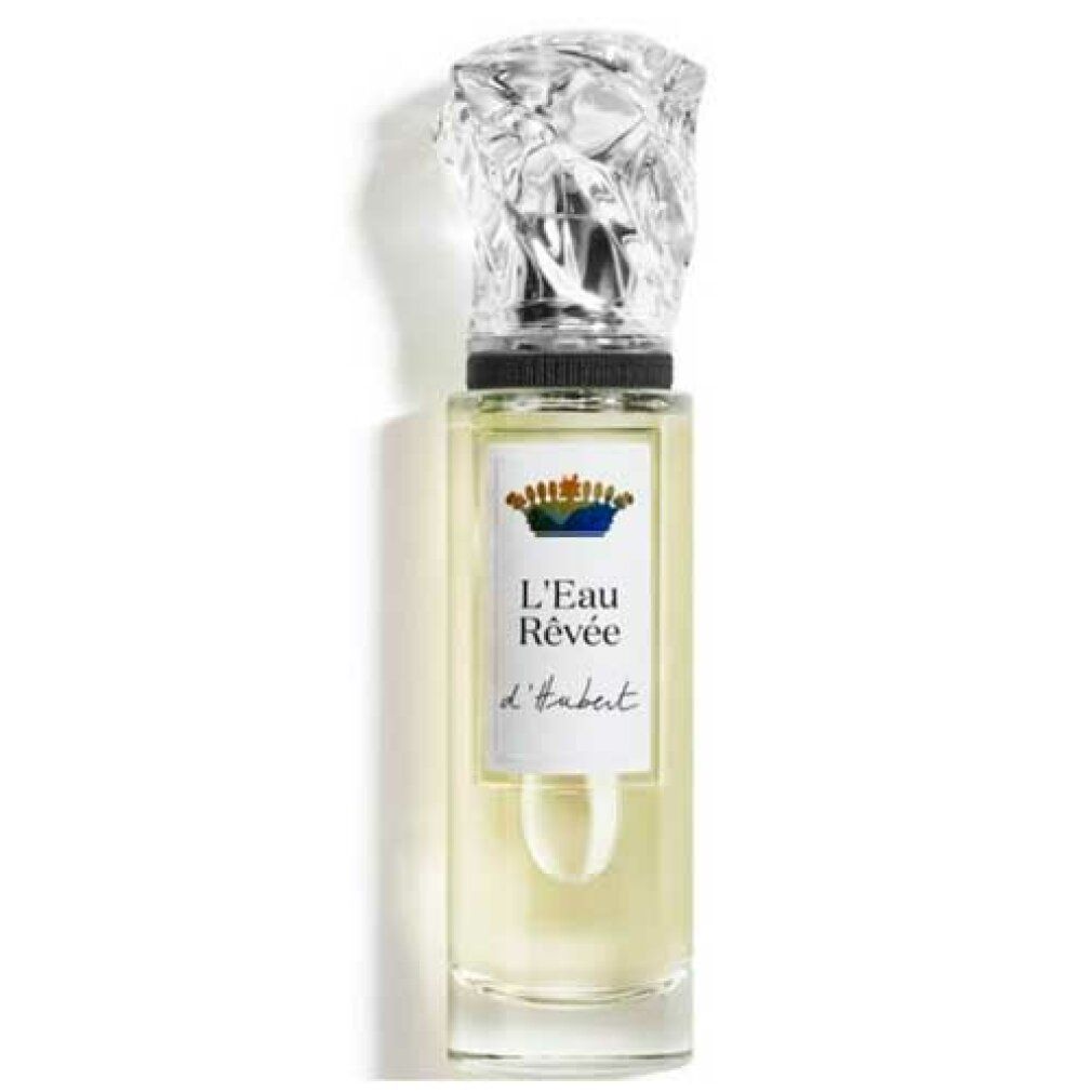 Parfumfles van helder glas met een sierlijke zilveren dop. Het etiket vermeldt 'L'Eau Rêvée d'Hubert'.