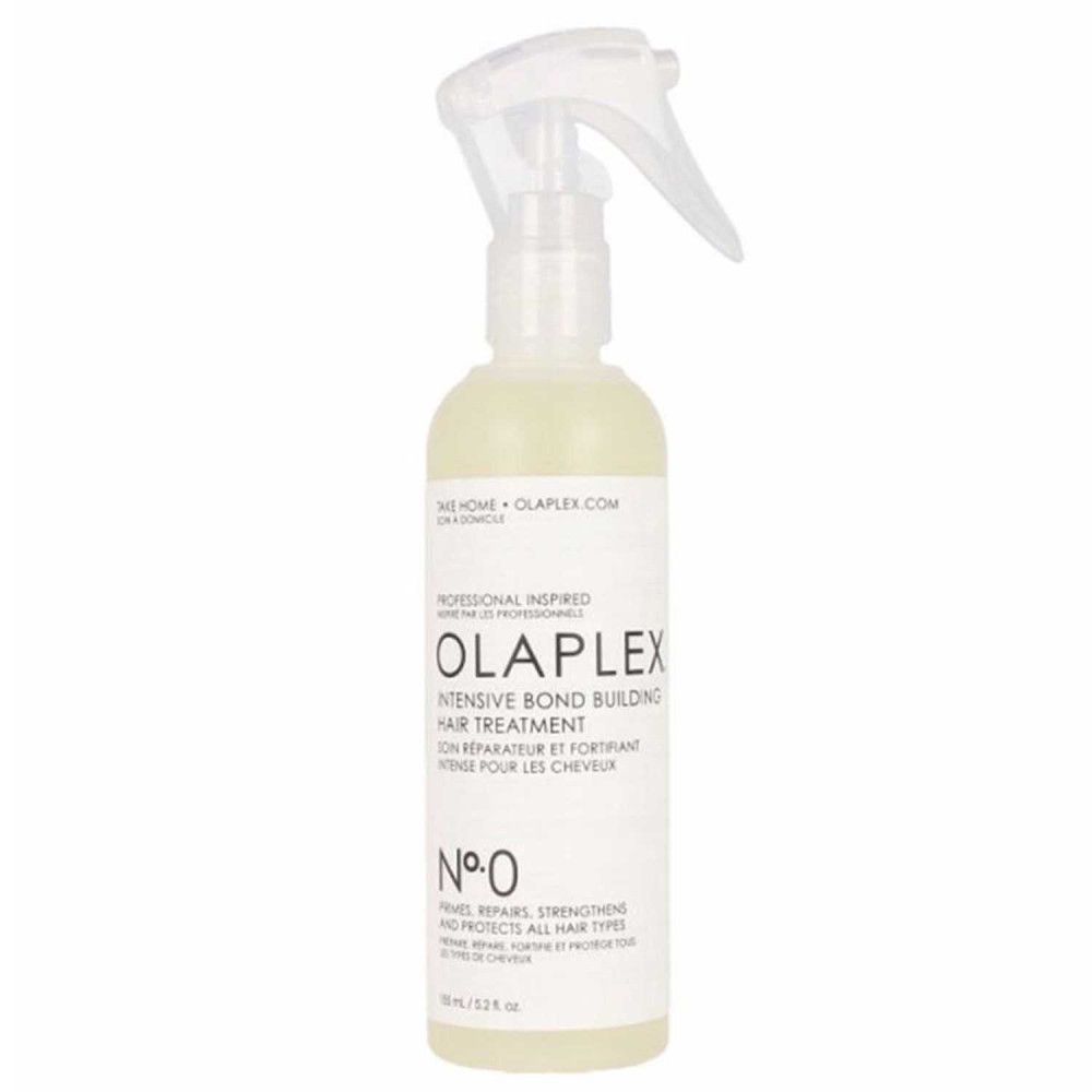 Flacon transparent avec vaporisateur. Contient un liquide jaunâtre. Inscription : OLAPLEX Intensive Bond Building Hair Treatment No. 0.