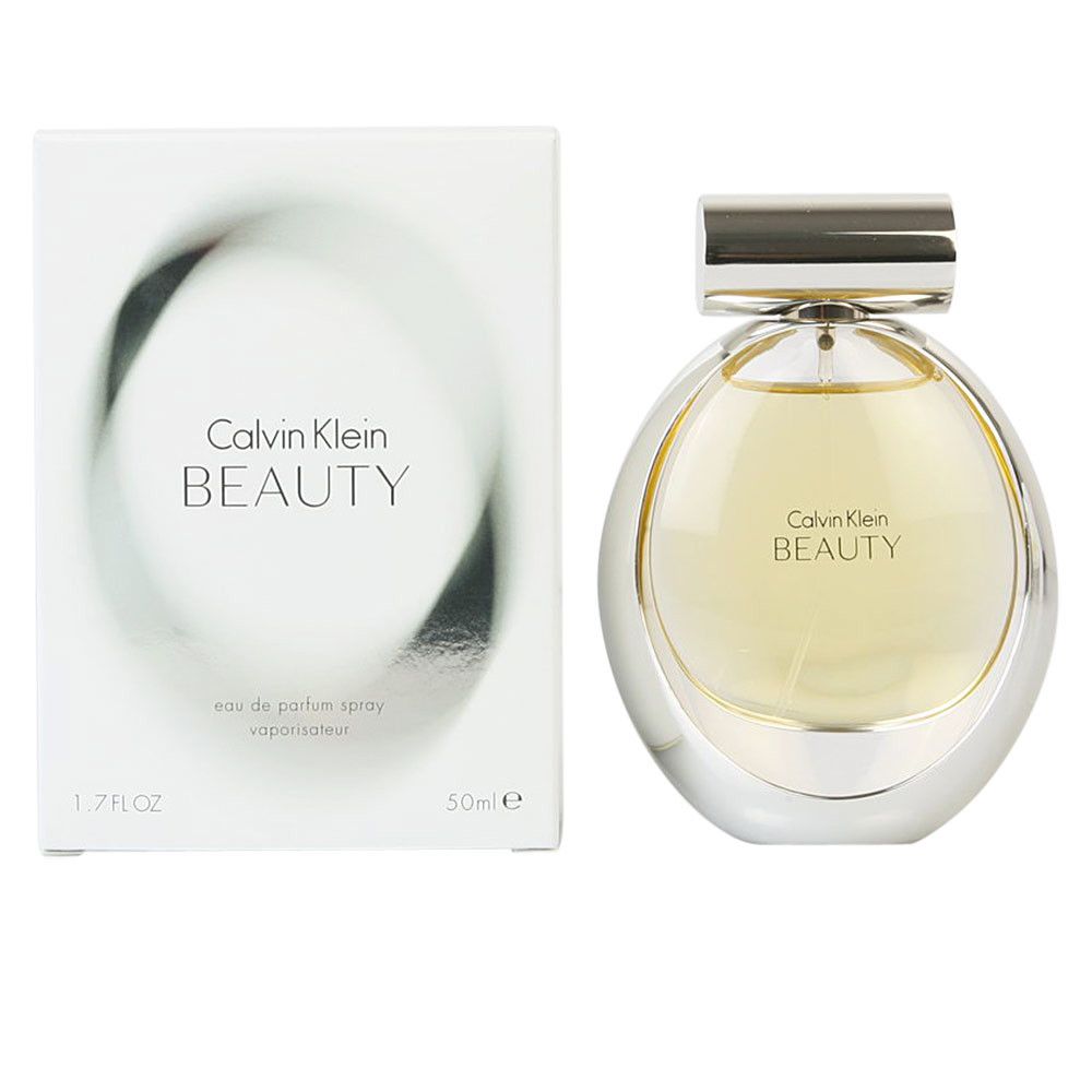 Parfumspray met verpakking. Fles met zilveren dop en rond ontwerp. Opschrift: Calvin Klein BEAUTY.