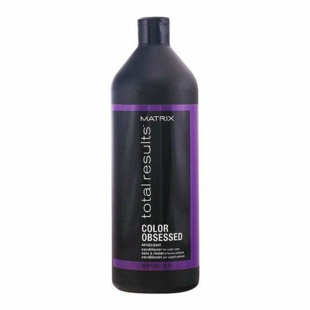 Flacon noir avec étiquette violette. Inscription: Matrix Total Results Color Obsessed Conditioner. 1 litre.