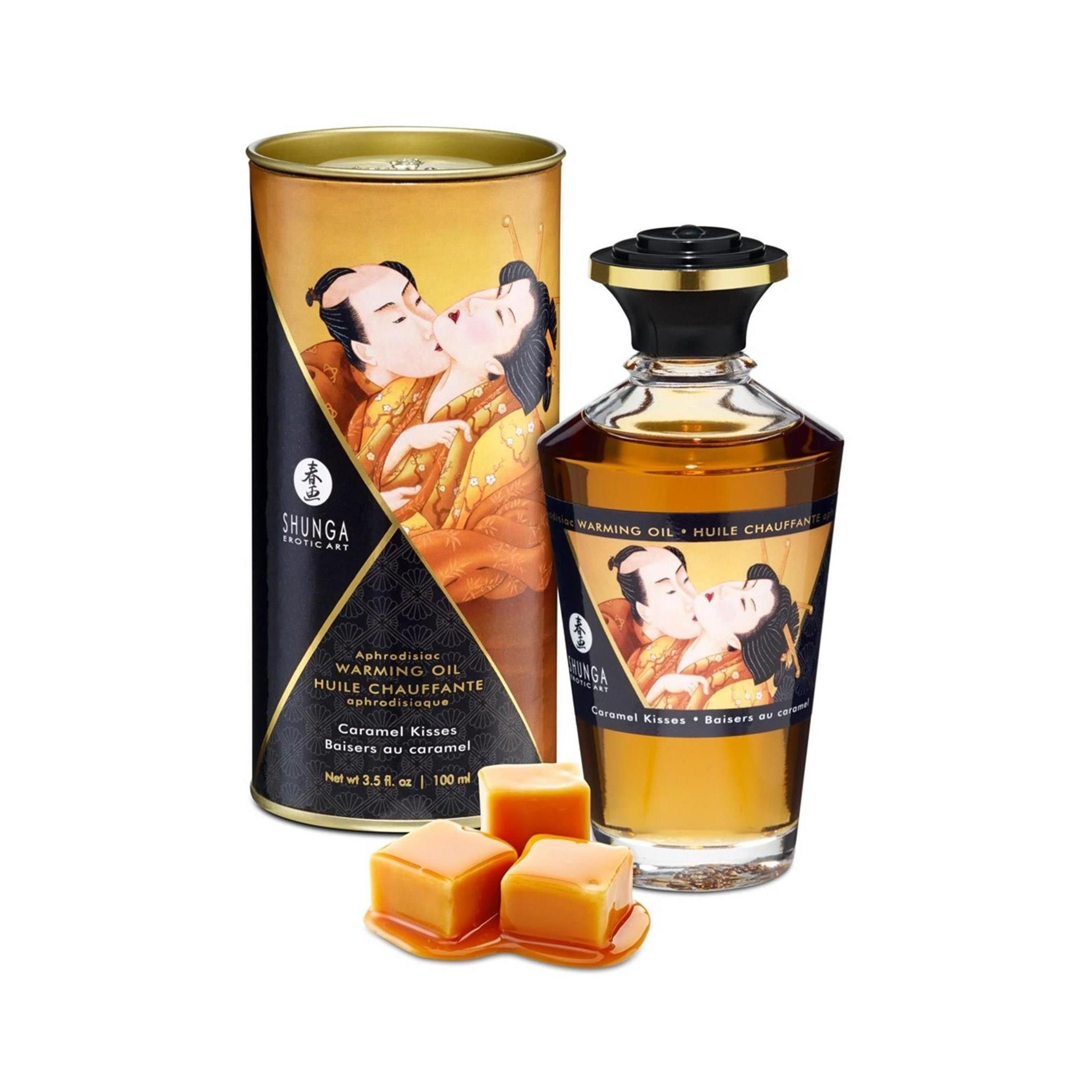 Cilindrische doos en oliefles. Doos met afbeelding van een kussend paar. Fles met zwarte dop en etiket.