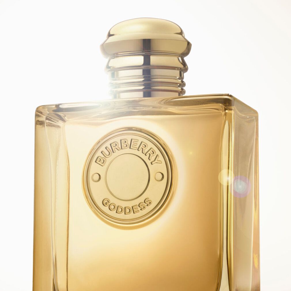 Flacon doré avec bouchon doré. Inscription Burberry Goddess.