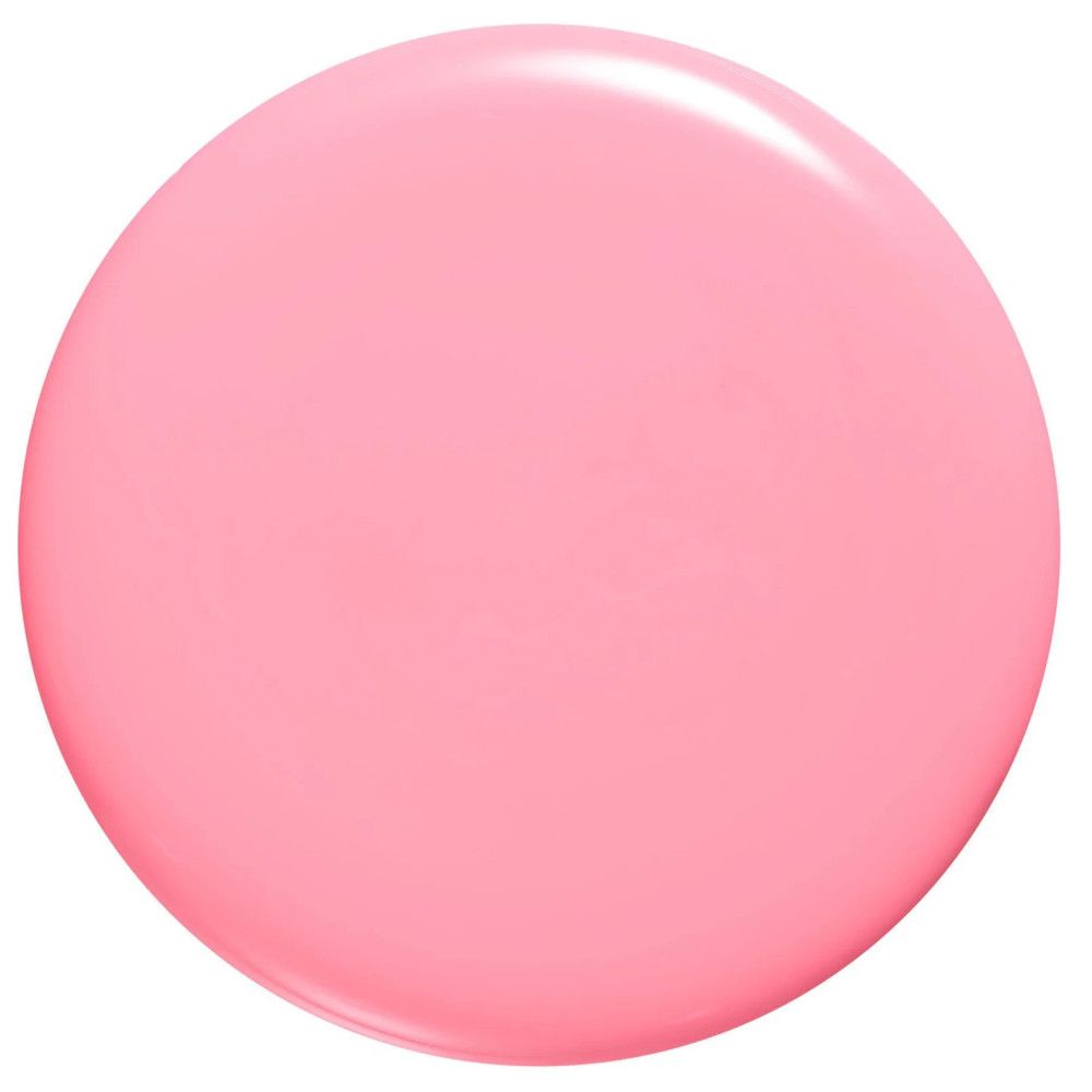 Een ronde, glanzende vlek lichtroze nagellak.