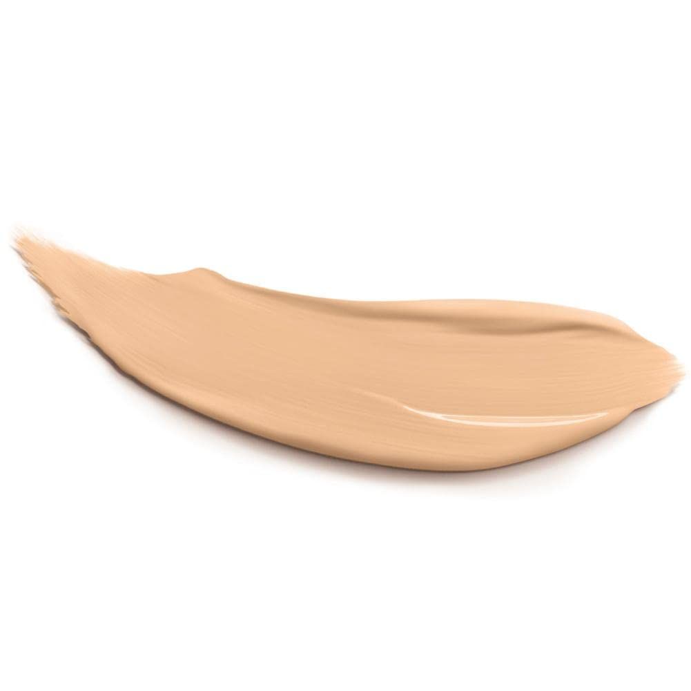 Échantillon de correcteur beige sur fond blanc. Texture : lisse, consistance crémeuse.