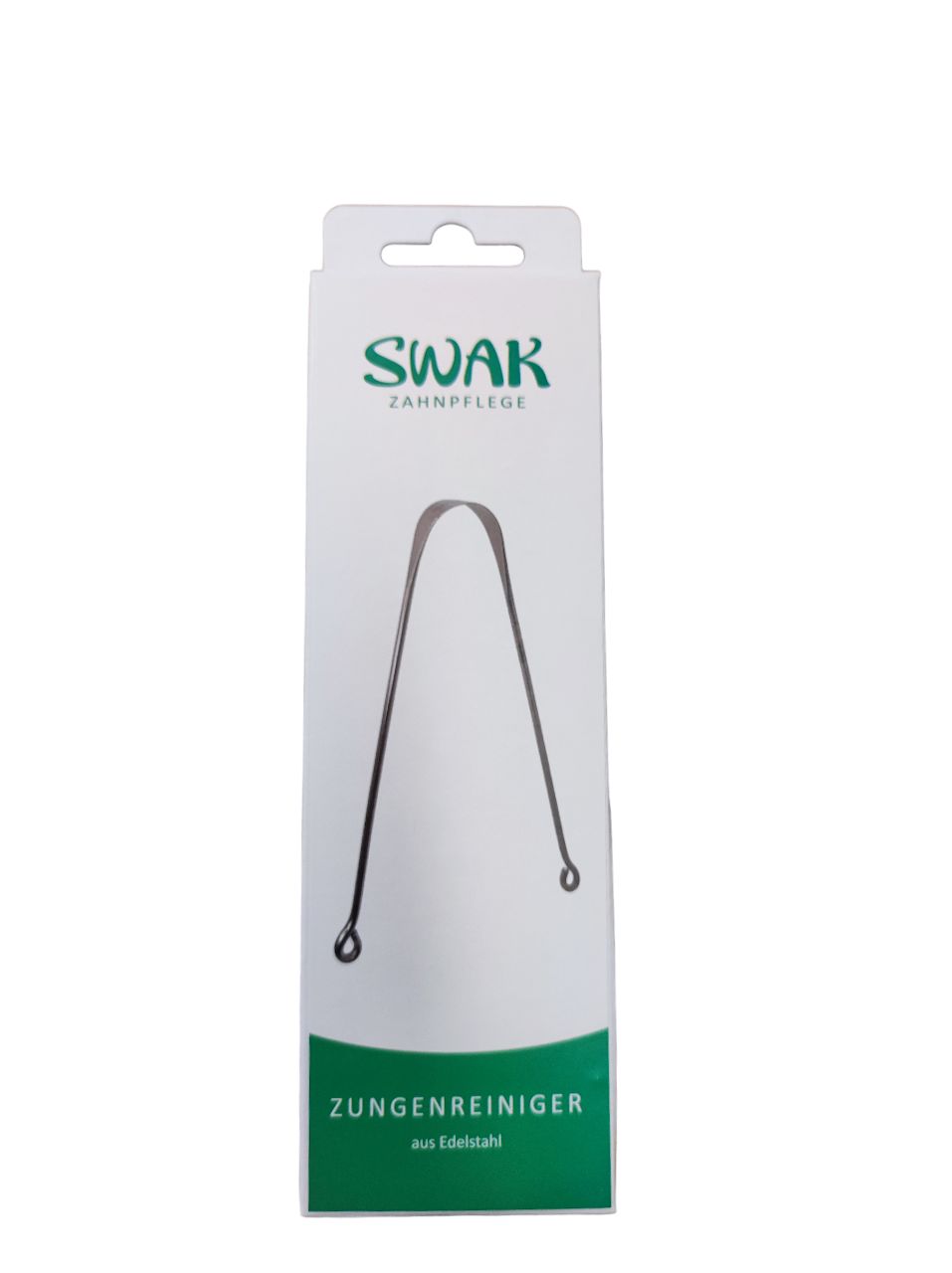 Nettoyeur de langue dans son emballage. Acier inoxydable, texte vert. Marque : SWAK. Texte : Nettoyeur de langue en acier inoxydable.
