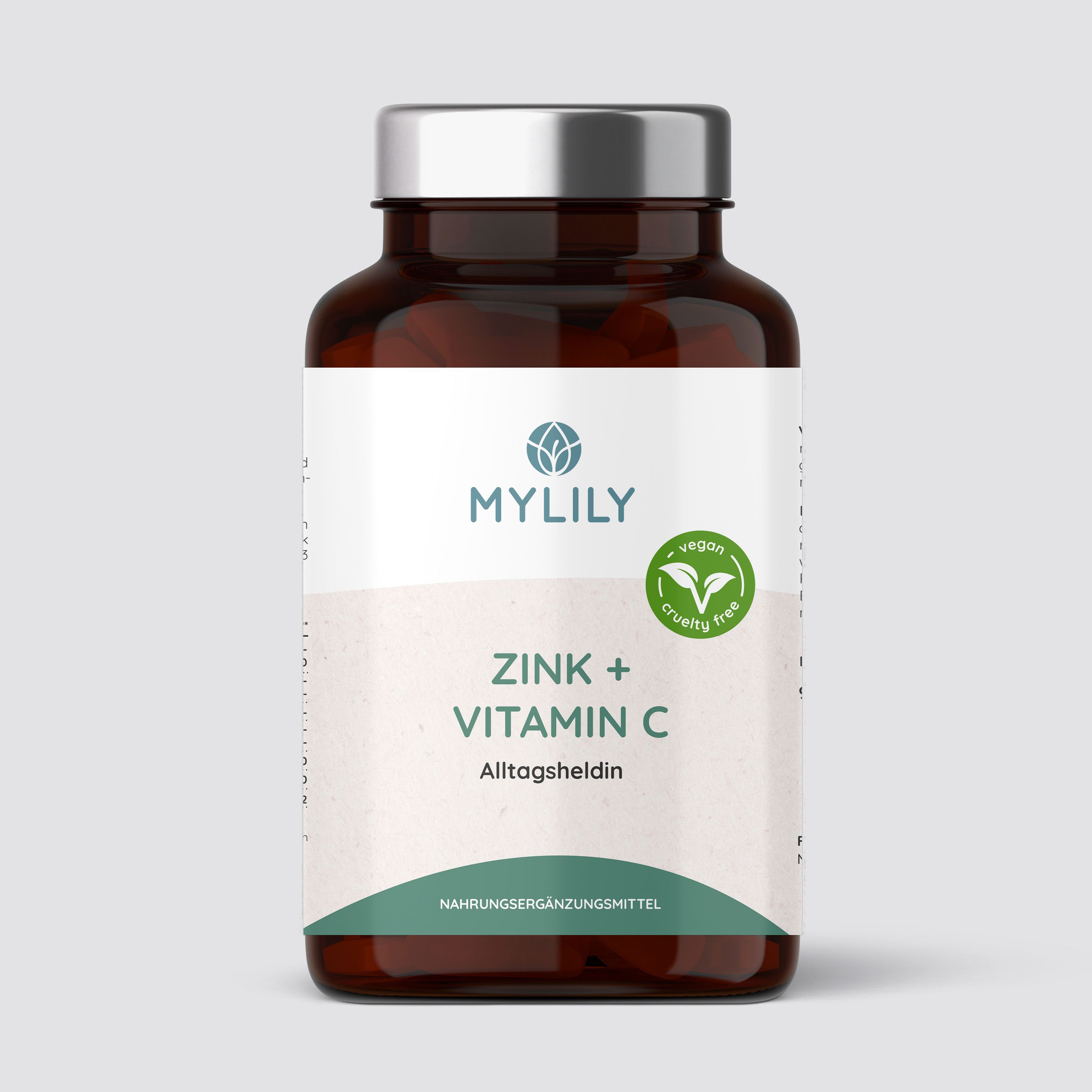 Flacon brun avec étiquette blanche. Inscription : MYLILY, Zinc + Vitamine C, Alltagsheldin. Label végétalien.