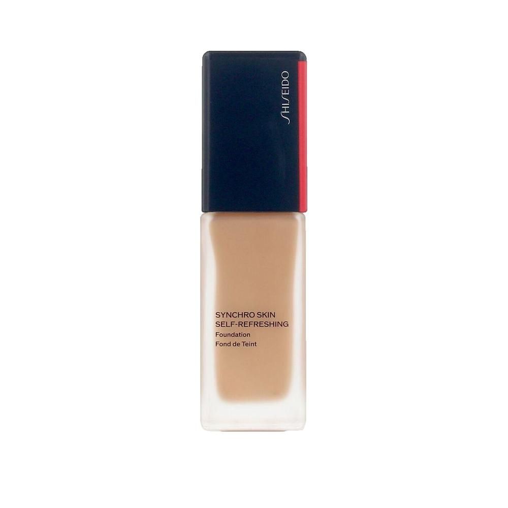Flacon de fond de teint. Forme rectangulaire, contenant transparent, bouchon bleu foncé avec accent rouge. Inscription: Shiseido, Synchro Skin Self-Refreshing.