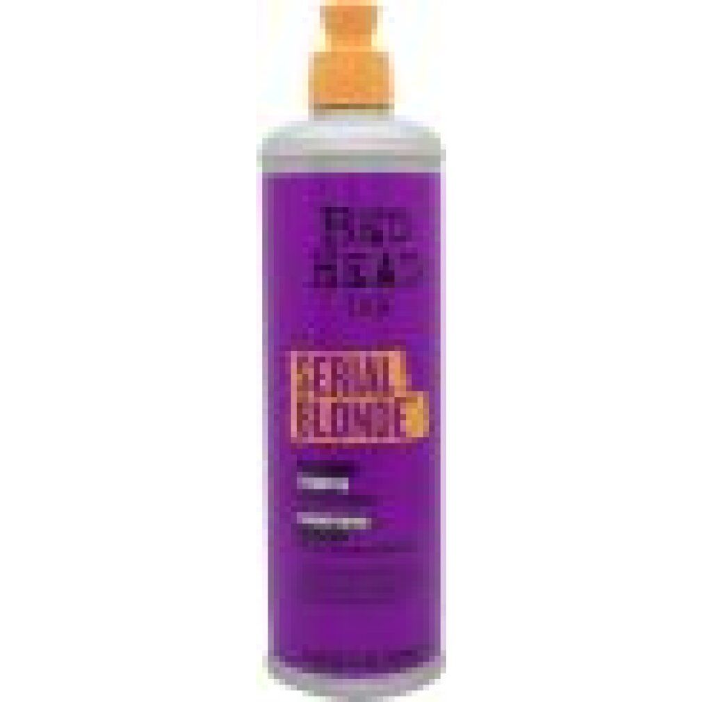 Paarse fles met gele pompdos. Tekst op etiket: "RED HEAD", "SERIAL BLONDE".