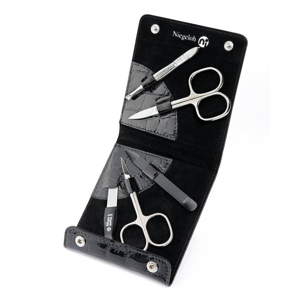 Étui noir avec outils de manucure. Ciseaux, lime à ongles et autres instruments. Marque Niegeloh.