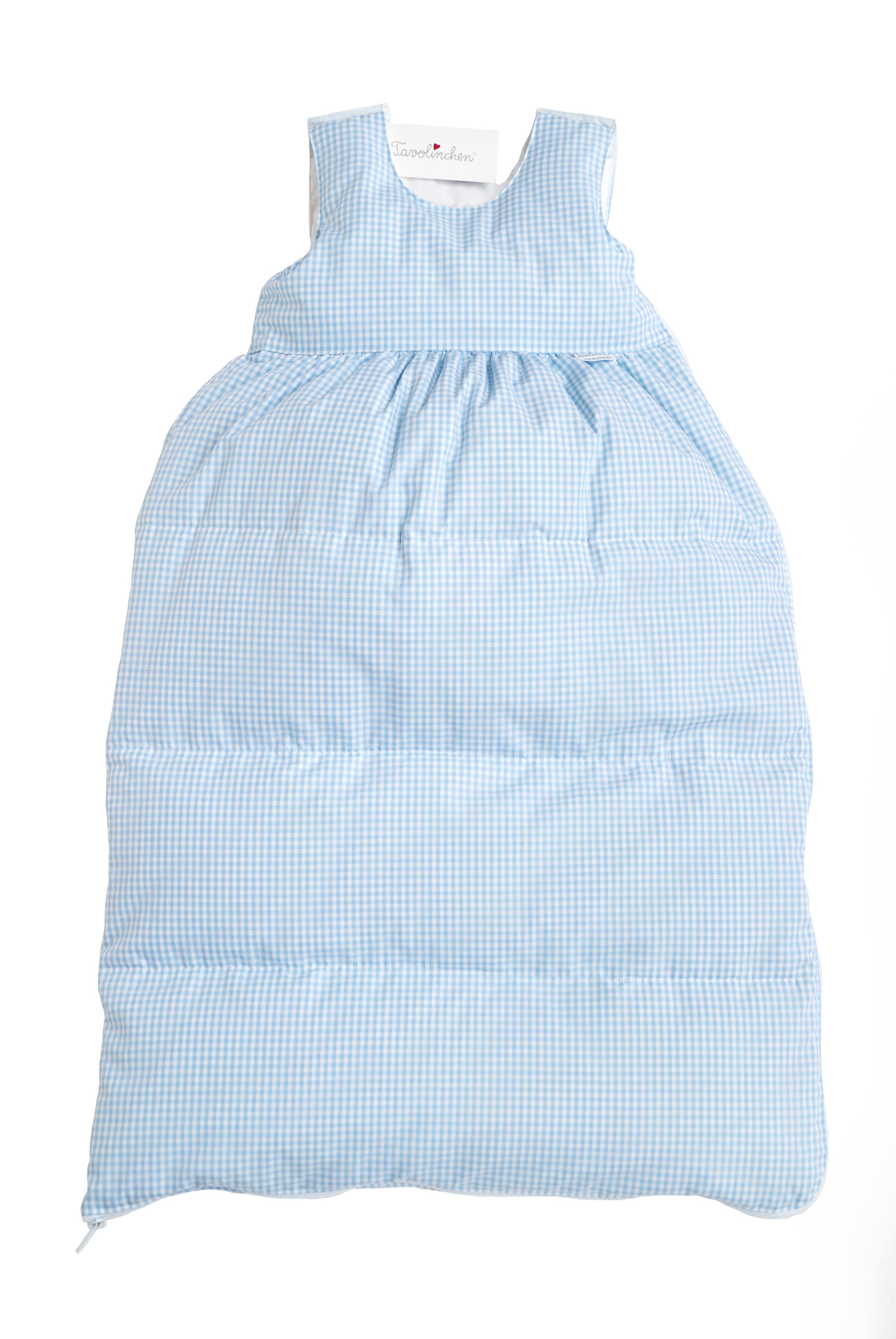 Gigoteuse à carreaux bleus. Design matelassé. Doublure blanche. Étiquette en haut.