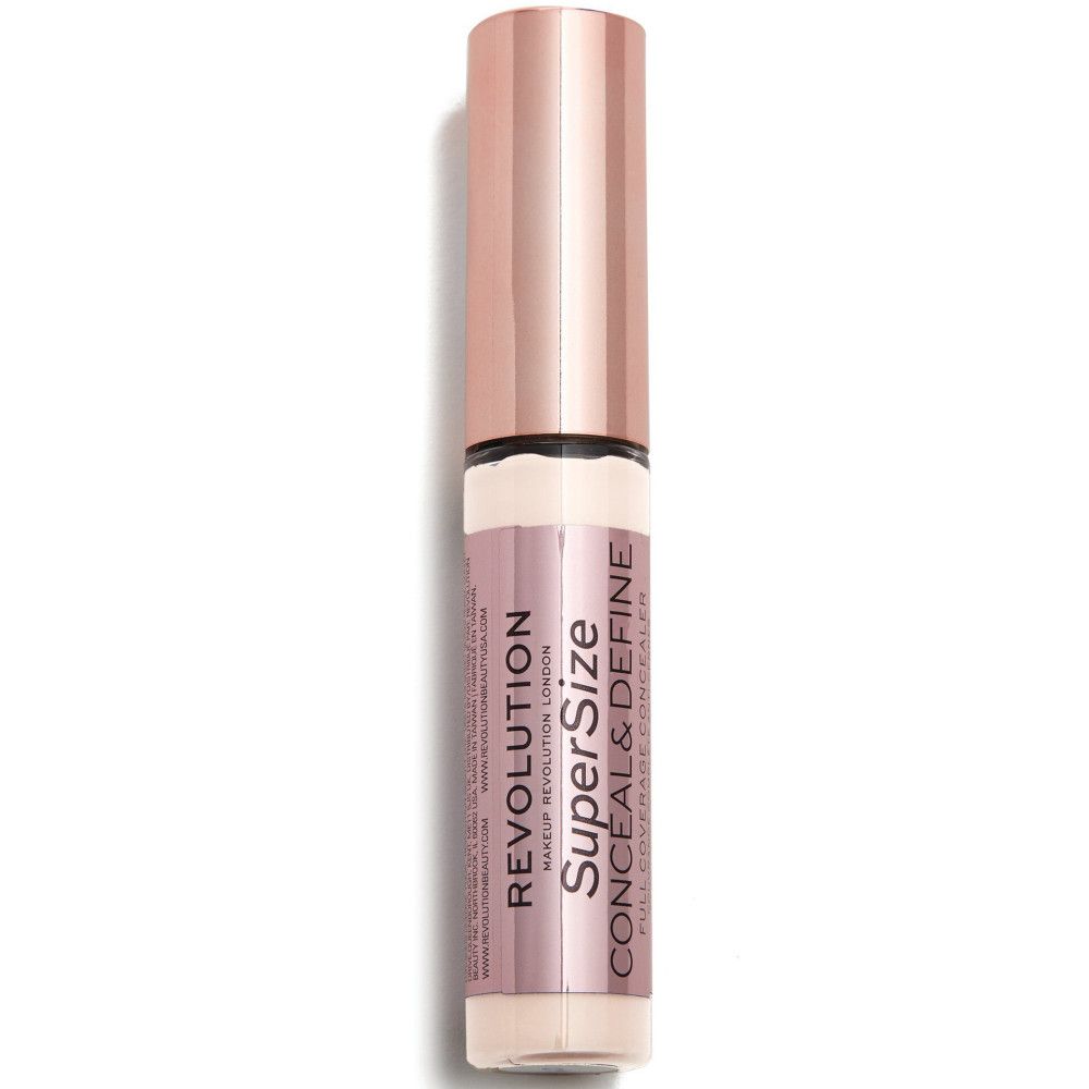 Flacon de correcteur. Bouchon or rose. Nom du produit et marque visibles.