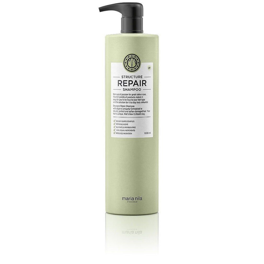 Flacon vert clair avec distributeur noir. Contient le shampooing Structure Repair de Maria Nila.