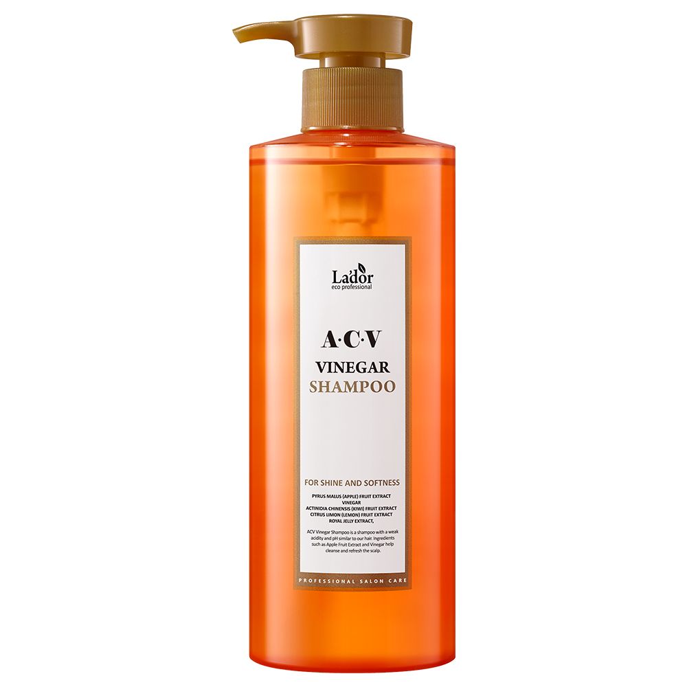 Oranje fles met pompdosering, Lador A.C.V. Azijnshampoo voor glans en zachtheid.