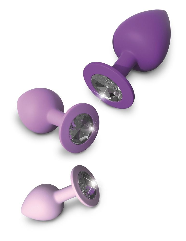 Trois plugs anaux violets, de petit à grand, avec une base large.