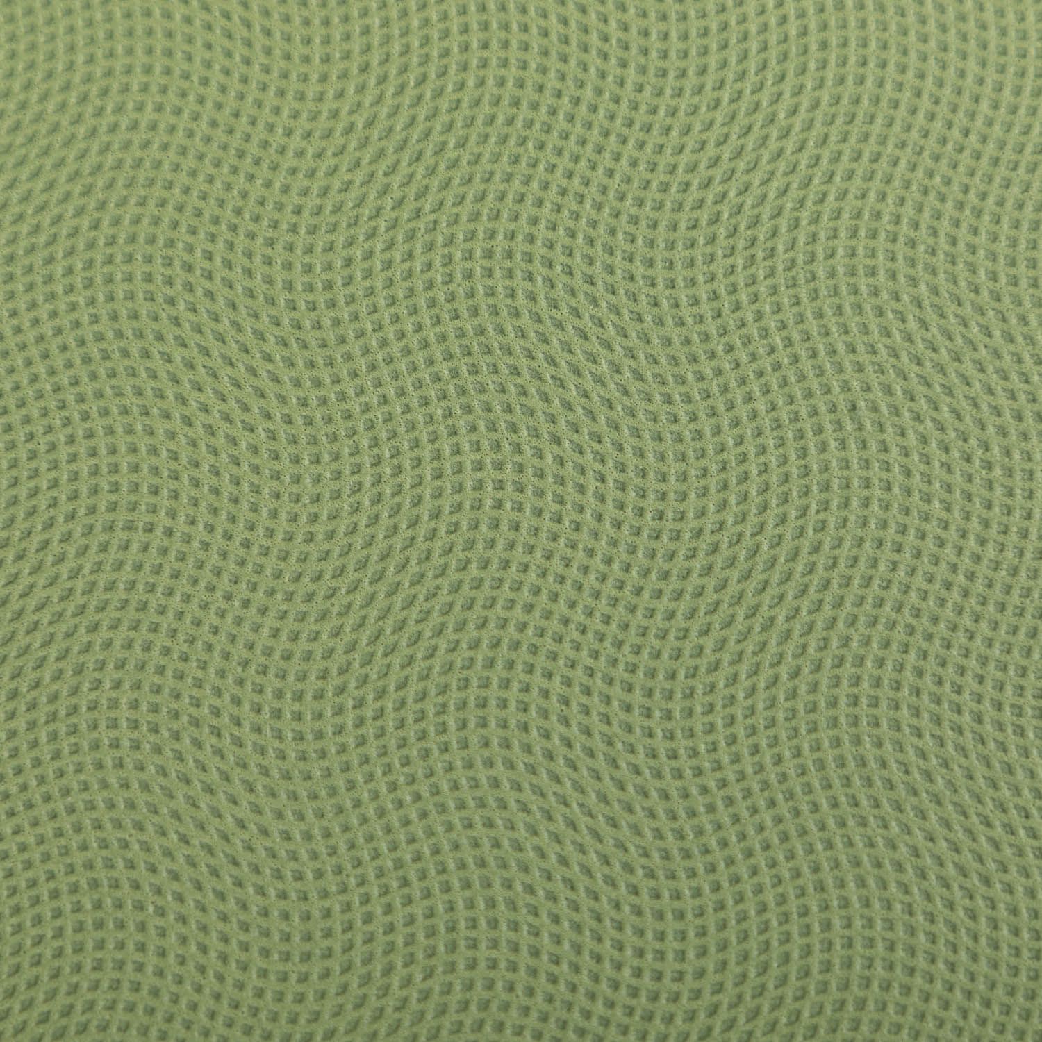 Groen yogamat-oppervlak met golfpatroon. Natuurrubber. Close-up.