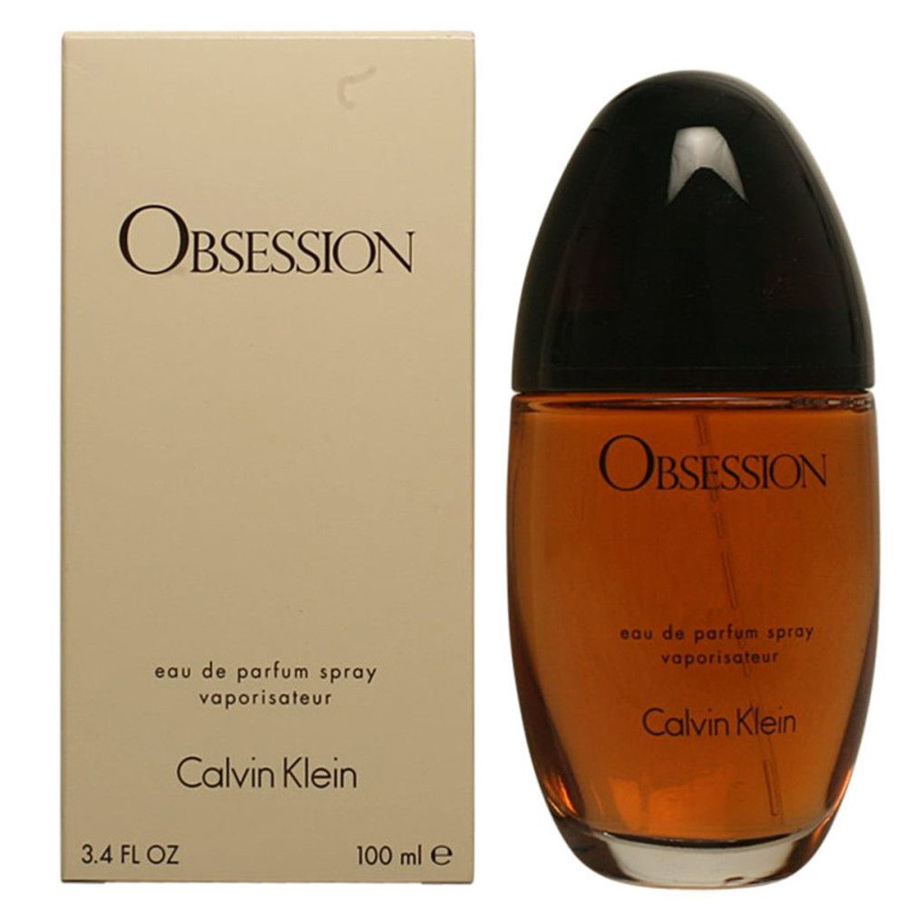 Parfumfles en verpakking. Opschrift Obsession, Calvin Klein. Fles bruin, dop zwart.