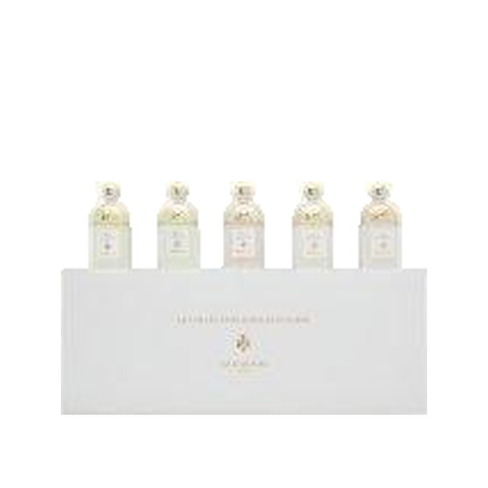 Set van vijf miniatuur parfumflesjes op witte verpakking. Gouden doppen.