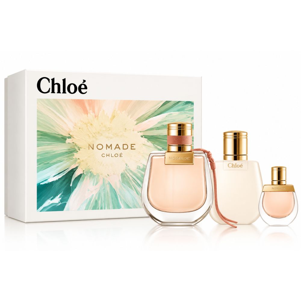 Coffret de parfum pour femme Chloe Nomade avec trois flacons et une boîte cadeau à motif floral.