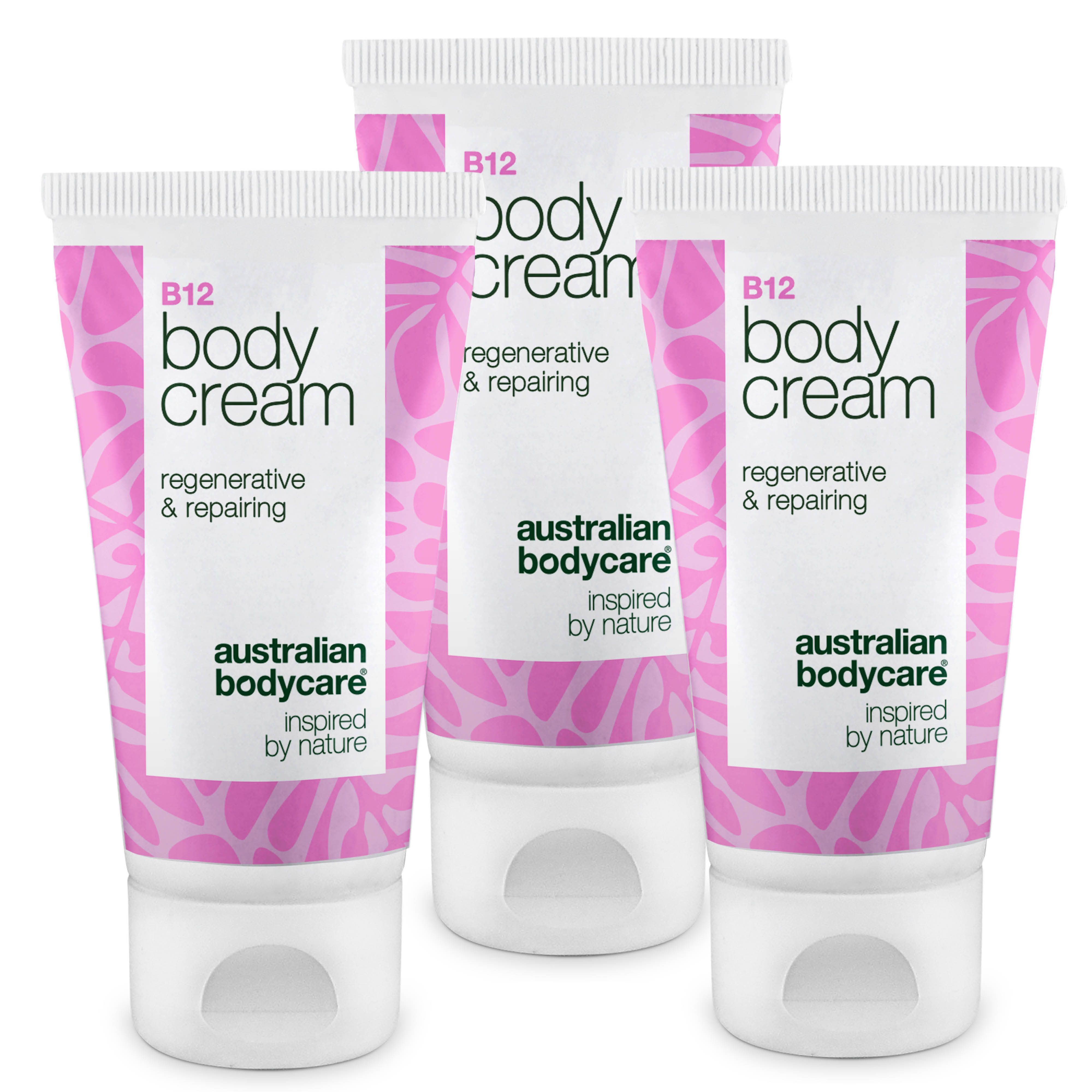 Trois tubes de crème. Bouchon blanc, motif rose, texte B12 Body Cream, régénérant & réparateur, Australian Bodycare.