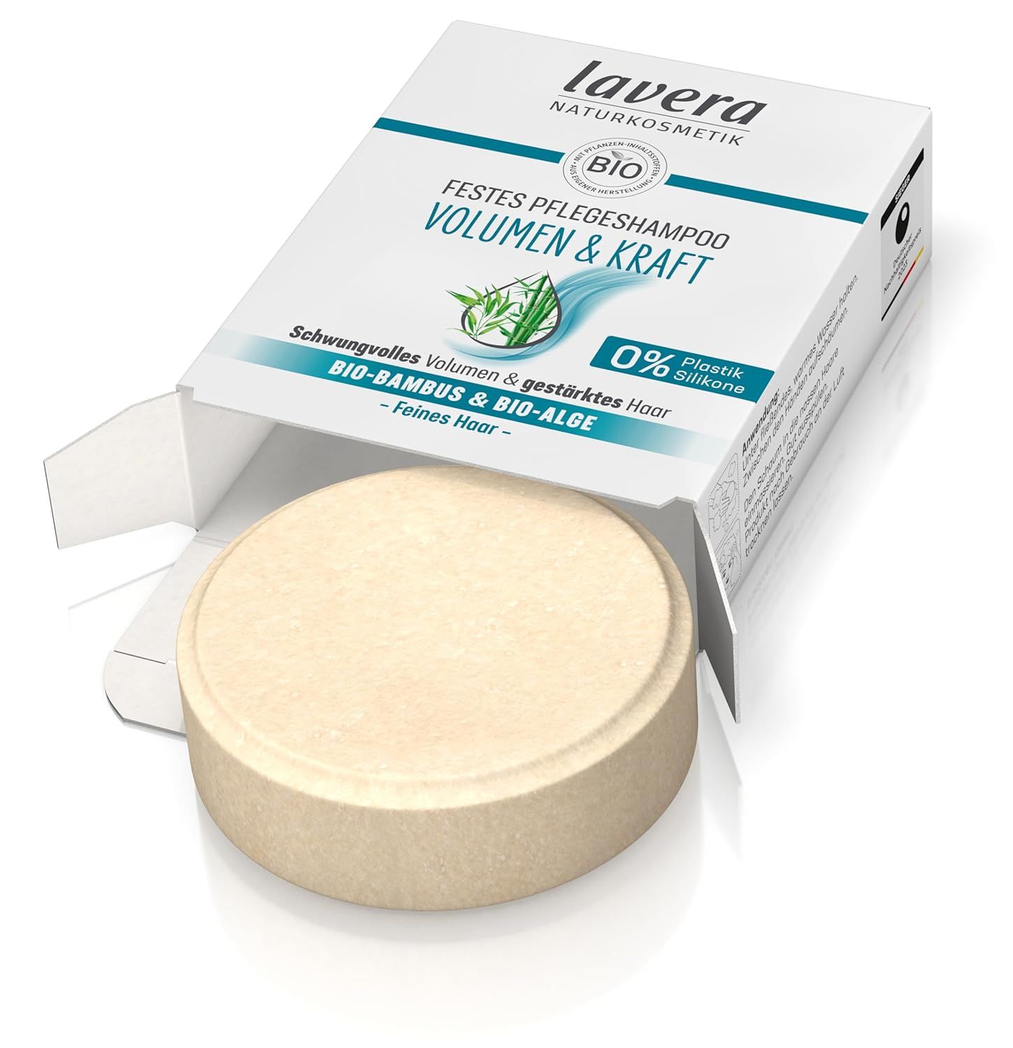Geopende verpakking van lavera Festes Pflegeshampoo Volumen & Kraft. Rond, vast shampoo. Witte doos met productinformatie.