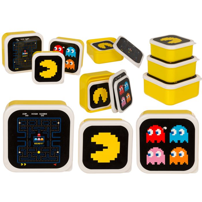 Gele brooddozen met Pac-Man-motieven. Meerdere dozen met verschillende ontwerpen, Pac-Man en geesten.