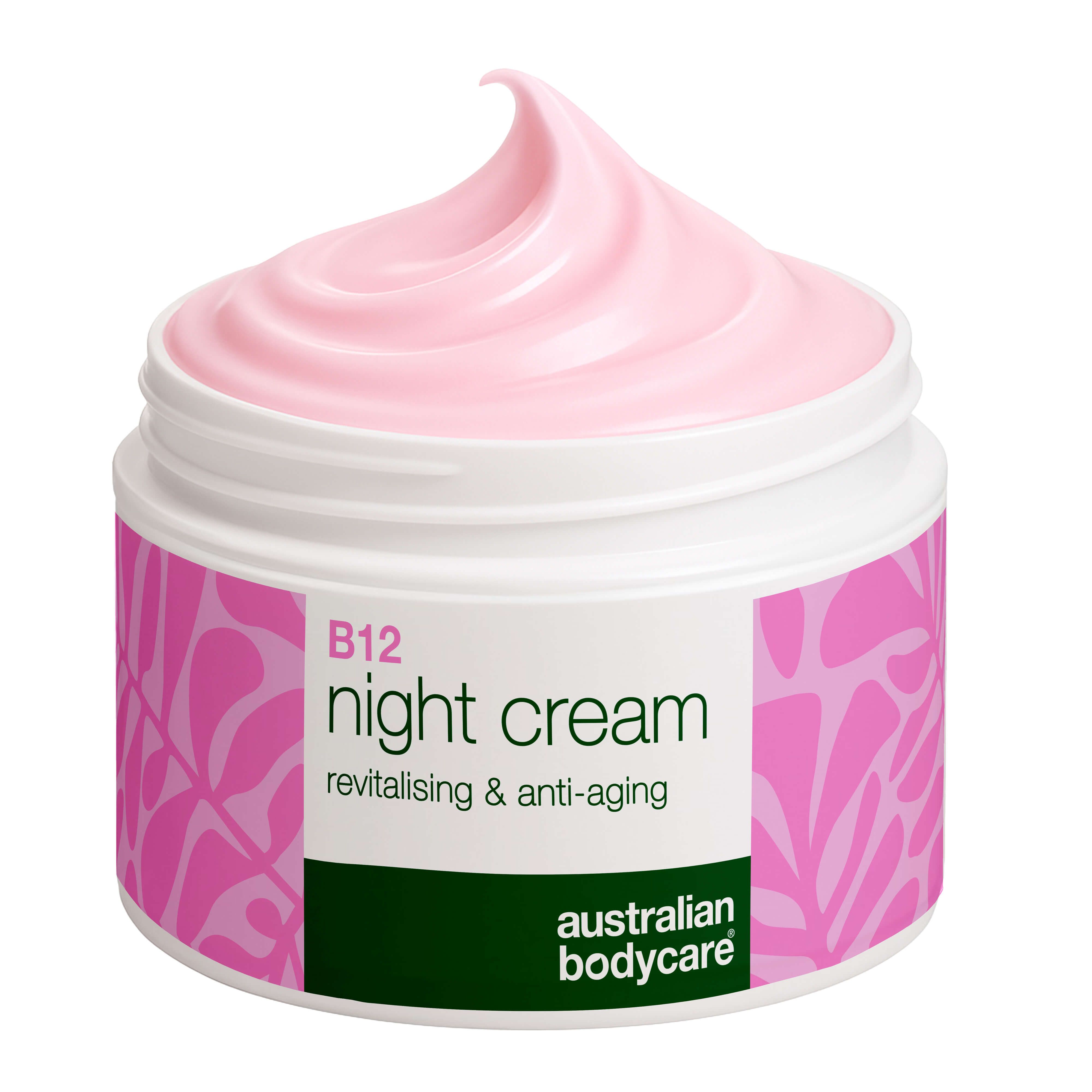 Roze crème in een open witte pot. Opschrift B12 Night Cream. Merk Australian Bodycare.