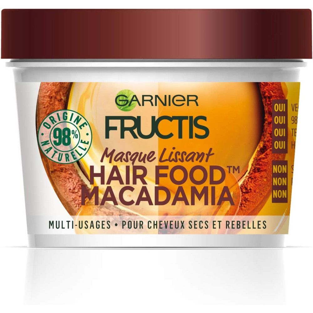 Pot Garnier Fructis Masque Lissant Hair Food Macadamia. Couvercle marron, contenant blanc avec étiquette. Texte: Multi-usages.